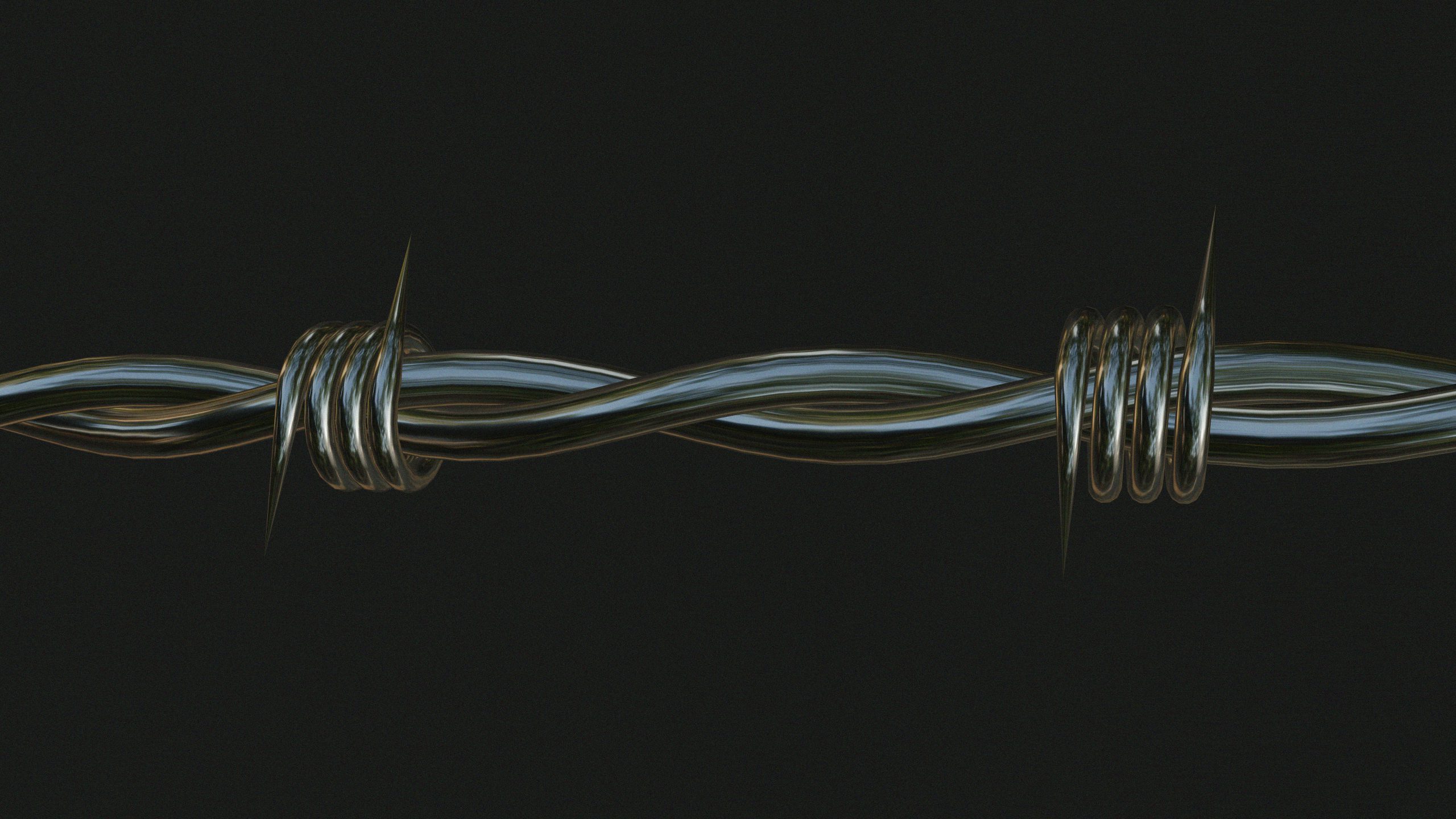 Metalowy drut kolczasty z ostrymi kolcami rozciągnięty na czarnym tle.